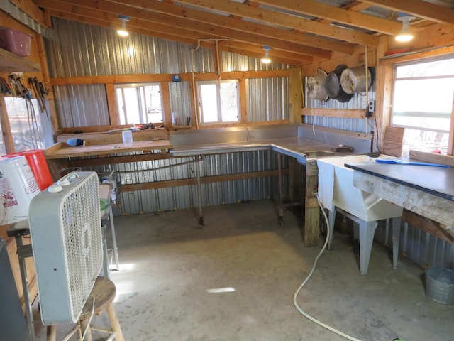 interior space with plenty of natural light and a workshop area