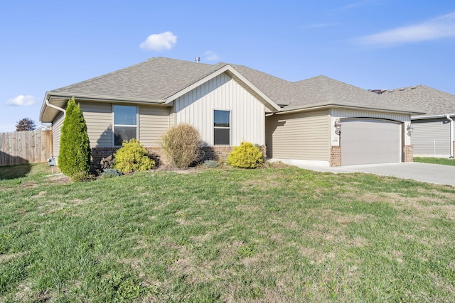 ranch-style house with a garage and a front lawn