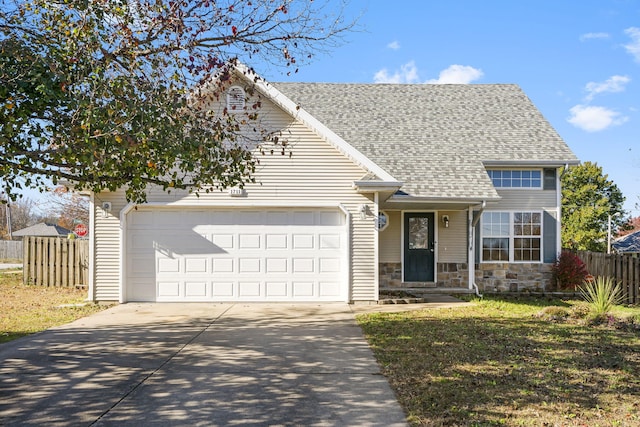 view of front of home with a garage and a front lawn