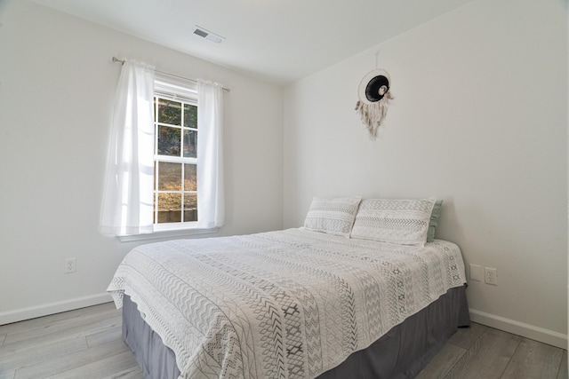 bedroom with light hardwood / wood-style floors