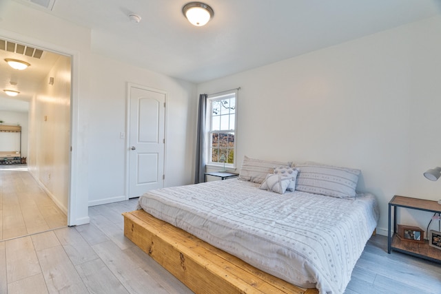 bedroom featuring light wood-type flooring