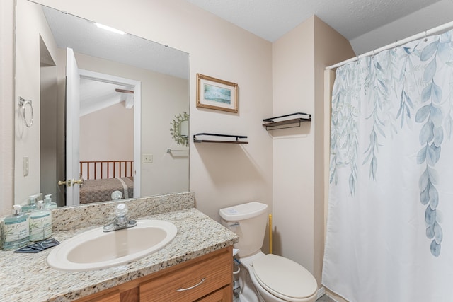 bathroom featuring a textured ceiling, vanity, toilet, and a shower with curtain