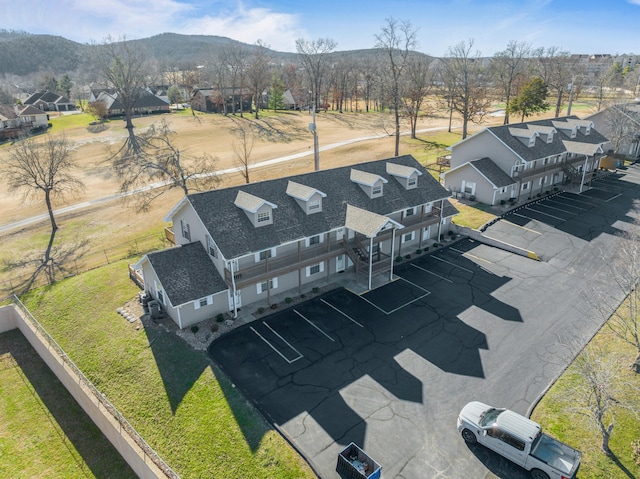 birds eye view of property with a mountain view