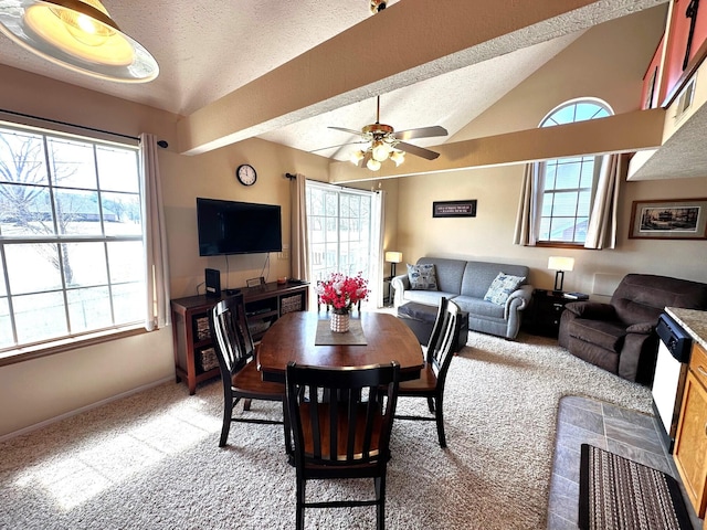 dining area featuring a textured ceiling, light colored carpet, ceiling fan, and lofted ceiling