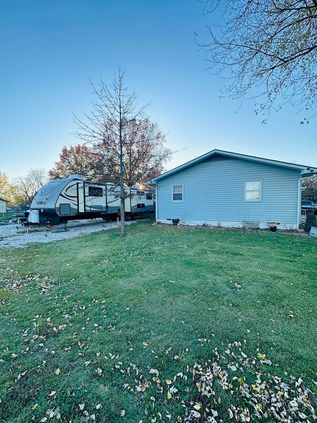 view of home's exterior featuring a yard