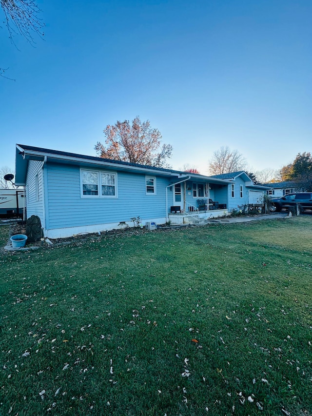 ranch-style house with a front lawn