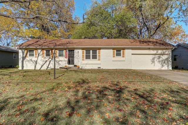 ranch-style house featuring an attached garage, brick siding, driveway, crawl space, and a front lawn