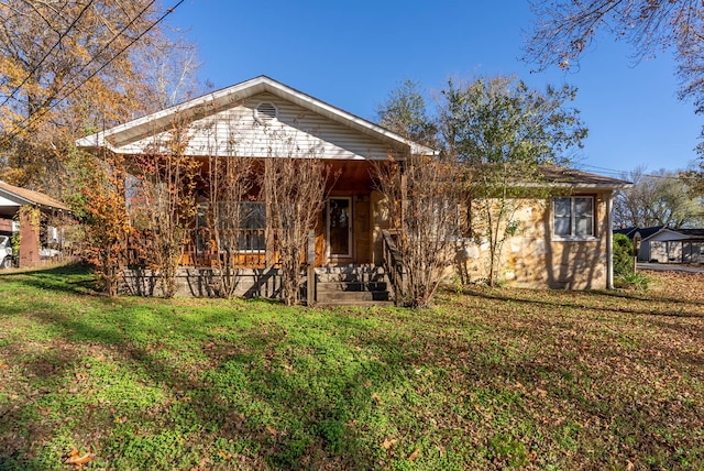 rear view of house with a lawn