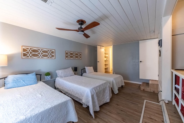 bedroom featuring wood-type flooring, ceiling fan, and wood ceiling