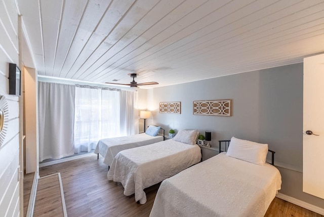 bedroom with hardwood / wood-style flooring, ceiling fan, and wood ceiling