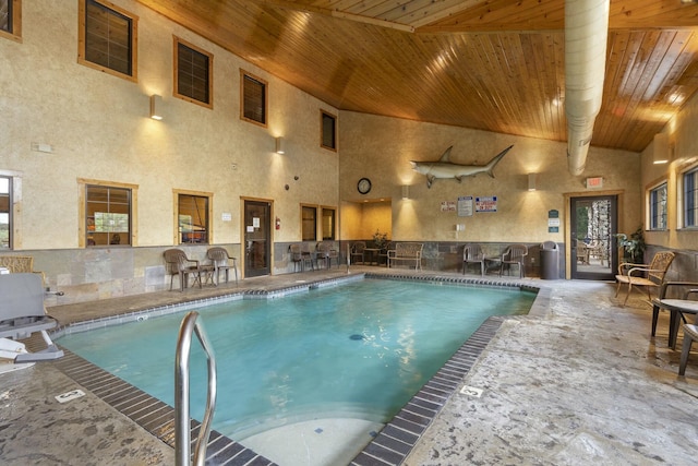 view of swimming pool featuring a patio and an outdoor kitchen