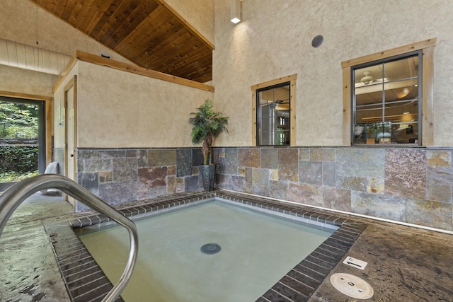 exterior space with an indoor hot tub