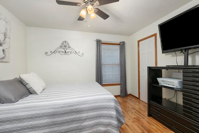 bedroom featuring ceiling fan and light hardwood / wood-style flooring