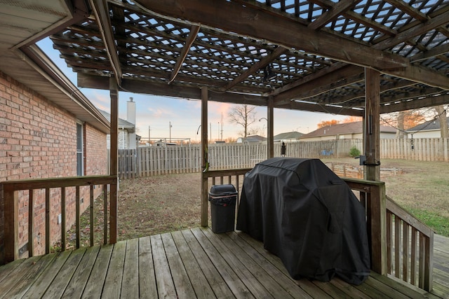 deck at dusk with a grill