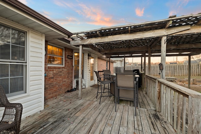 deck at dusk with a pergola