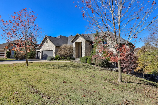 view of front facade featuring a garage and a front lawn