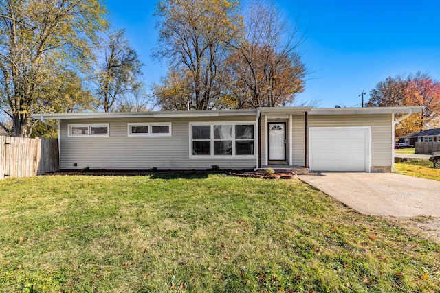 single story home featuring a front lawn and a garage