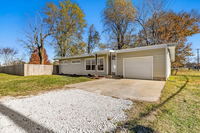 ranch-style home with a garage and a front yard