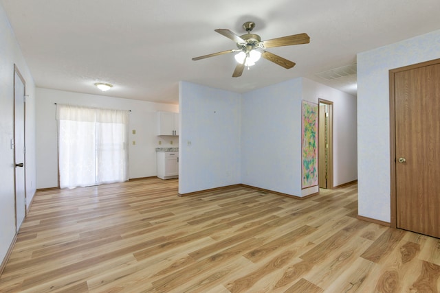 interior space with light hardwood / wood-style flooring and ceiling fan