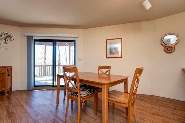 dining space featuring hardwood / wood-style flooring