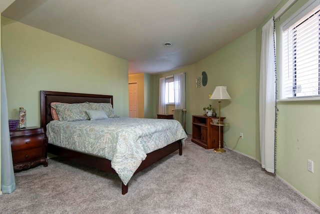 bedroom with light carpet