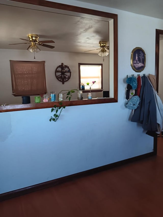 interior space featuring a ceiling fan