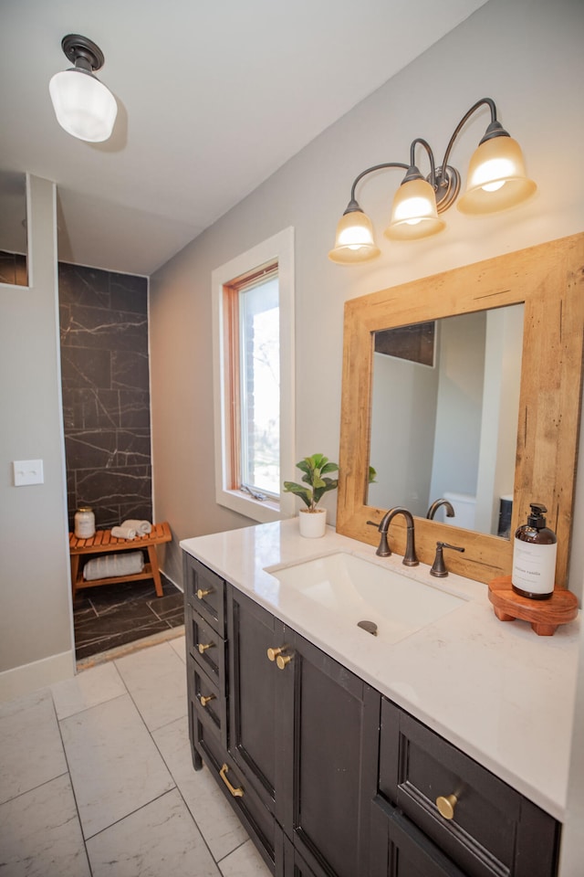 bathroom featuring tile patterned flooring and vanity