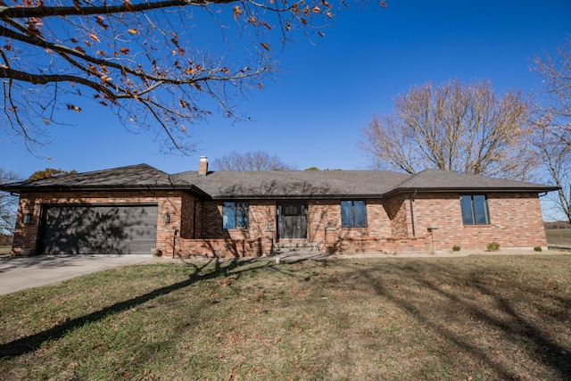 ranch-style home with a front yard and a garage