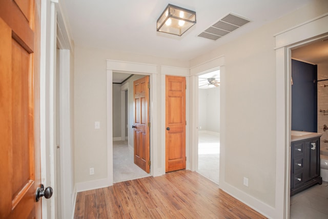 hall featuring light hardwood / wood-style floors