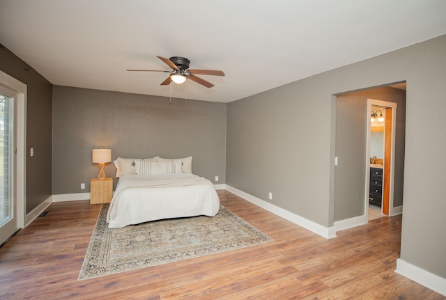 bedroom featuring hardwood / wood-style flooring and ceiling fan