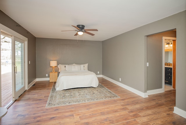 bedroom with ceiling fan, access to exterior, and wood-type flooring