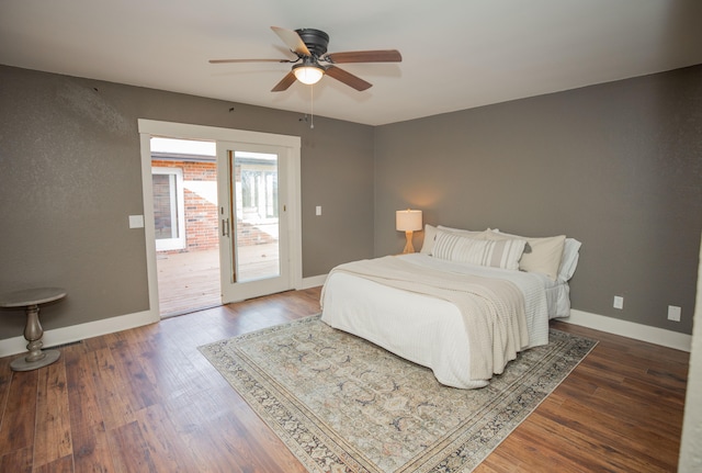 bedroom with ceiling fan, dark hardwood / wood-style floors, and access to exterior