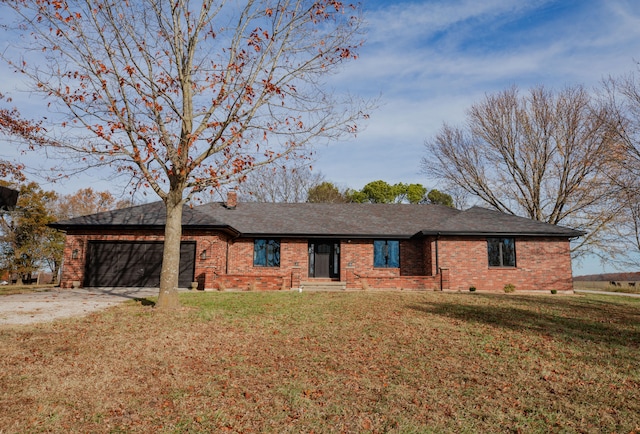 single story home with a front lawn and a garage