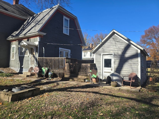 back of property featuring a wooden deck