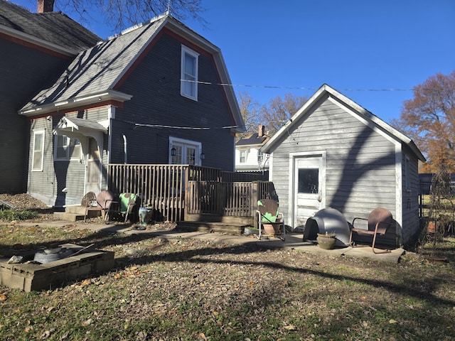 106 N Main St, Greenfield, MO 65661 - rear view of property with a deck