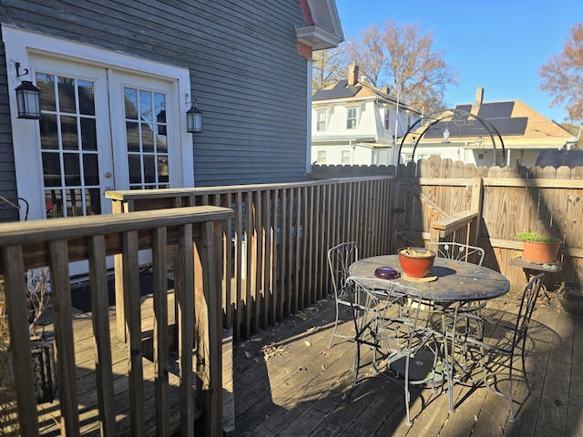 106 N Main St, Greenfield, MO 65661 - deck featuring french doors, outdoor dining space, and a residential view