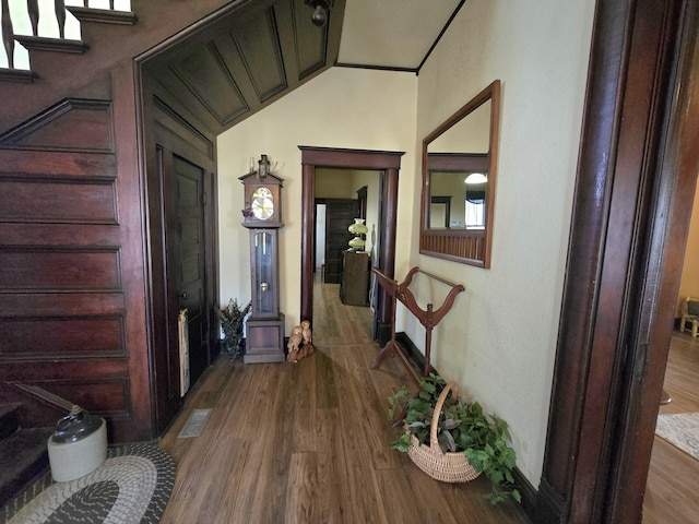 106 N Main St, Greenfield, MO 65661 - hallway with wood finished floors, stairway, and vaulted ceiling