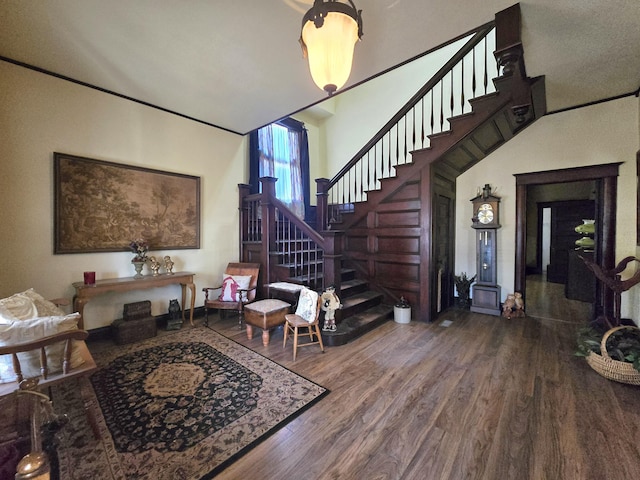 106 N Main St, Greenfield, MO 65661 - entryway featuring wood finished floors, stairway, and a high ceiling