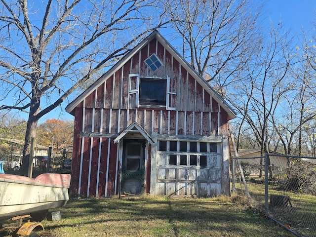 view of outdoor structure featuring a lawn