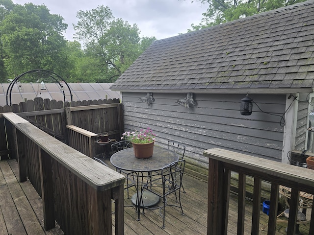 106 N Main St, Greenfield, MO 65661 - wooden terrace with outdoor dining space