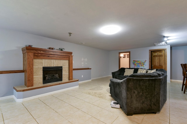 tiled living room with a fireplace