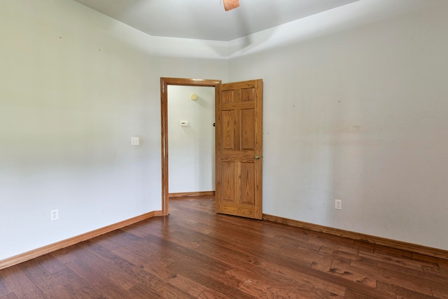 spare room with dark wood-type flooring