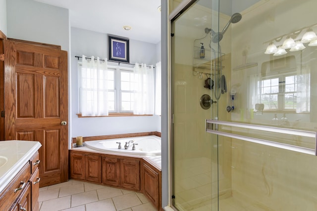 bathroom with tile patterned flooring, vanity, shower with separate bathtub, and a wealth of natural light