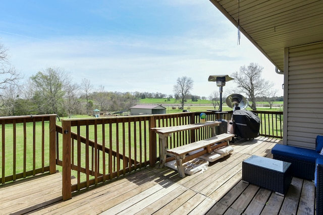 wooden deck with a lawn