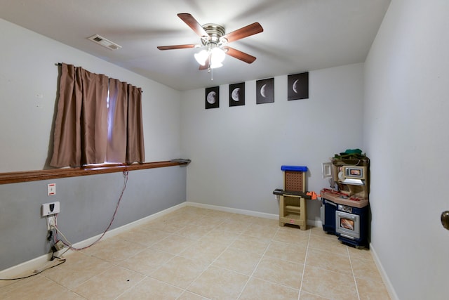 interior space with ceiling fan