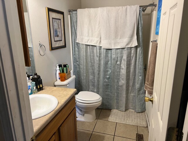 full bathroom with tile patterned flooring, vanity, toilet, and shower / tub combo with curtain