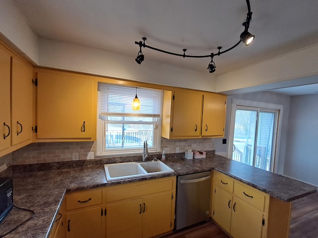 kitchen with backsplash, sink, stainless steel dishwasher, and plenty of natural light