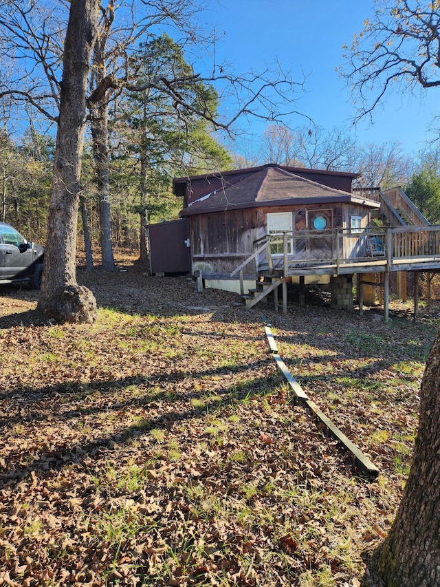 view of yard featuring a wooden deck