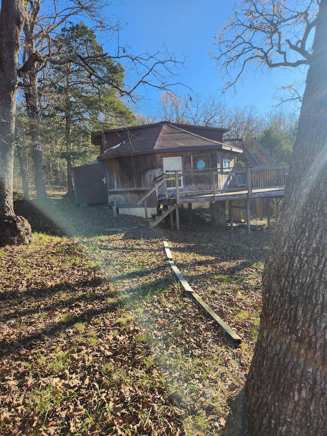 rear view of property with a wooden deck