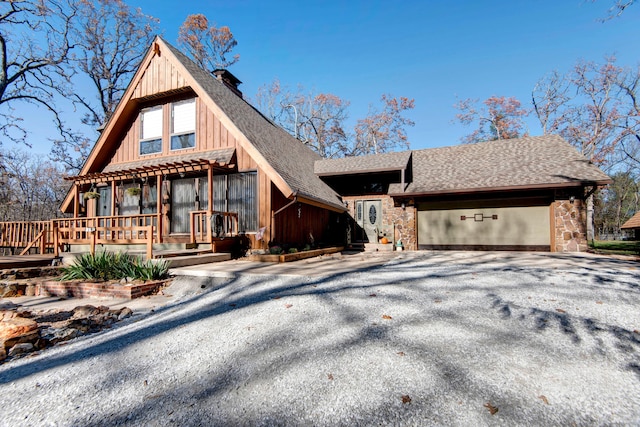 view of front of property with a porch and a garage